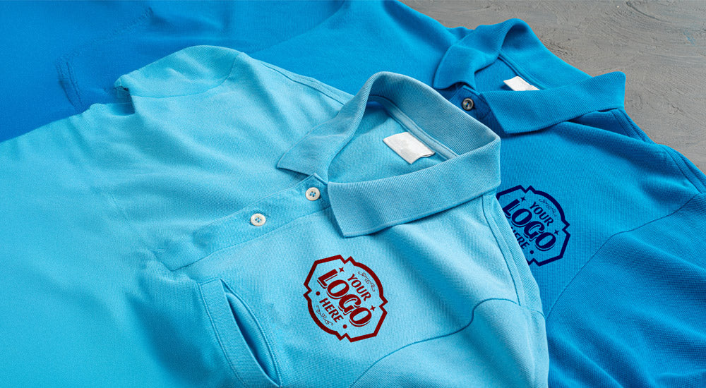 Custom blue polo shirts with placeholder logos for showcasing corporate branding and logo placement
