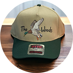 Beige and green cap with 'The Woods' and a flying duck embroidery, 'OTTO' label on brim
