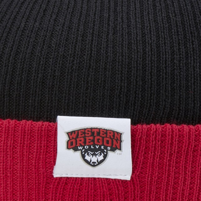 A black and red knitted beanie with a Western Oregon Wolves logo patch
