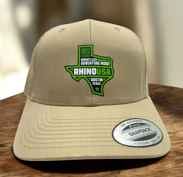 Khaki snapback hat with Rhino USA Texas green and white patch logo