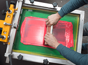 Screen printing process with red ink.