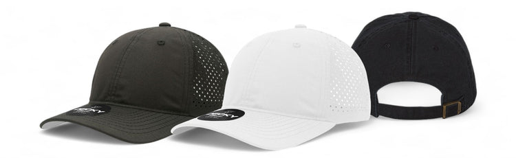 Three dad hats in black, white, and dark gray, featuring perforated patterns and a classic strap back