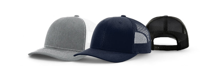 Three kids' baseball caps in gray, navy blue, and black with mesh back panels and curved brims