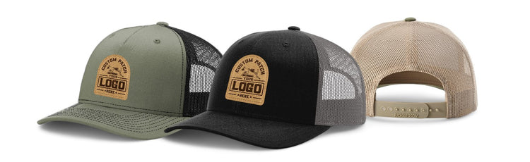 Trio of promotional trucker hats in olive, black, and beige, each with a customizable leather patch logo