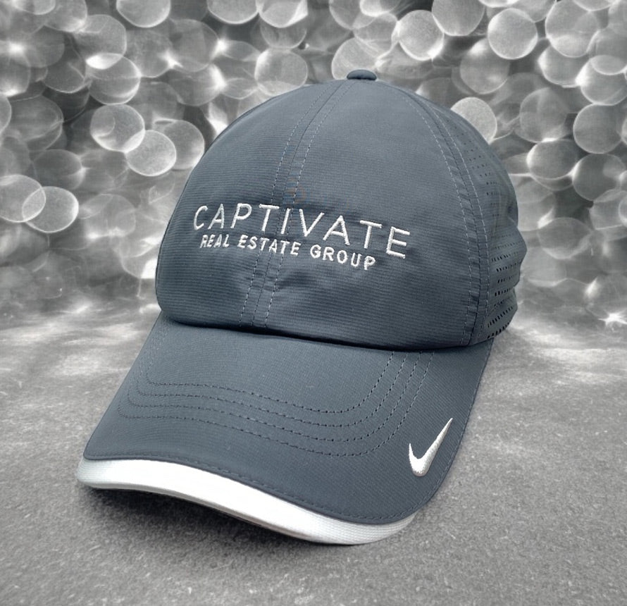 Grey Nike hat with 'CAPTIVATE Real Estate Group' logo.