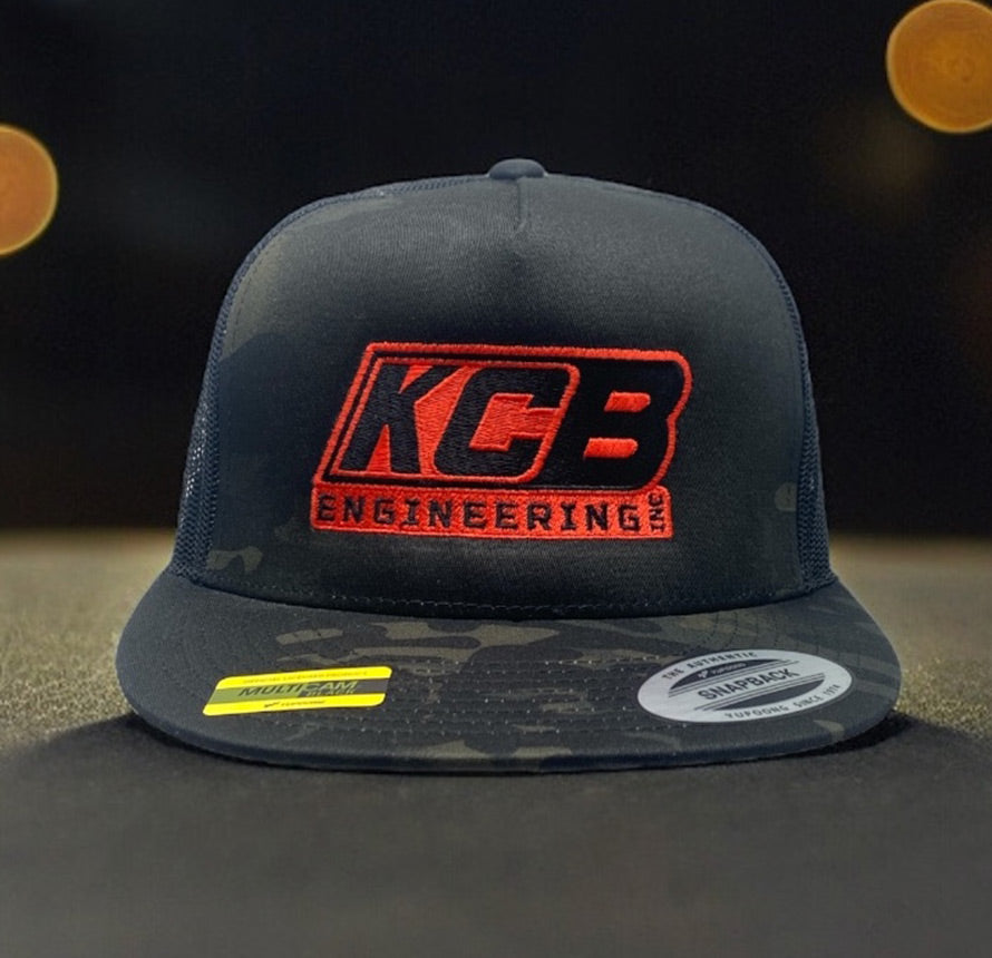 Black KCB Engineering hat with red logo.