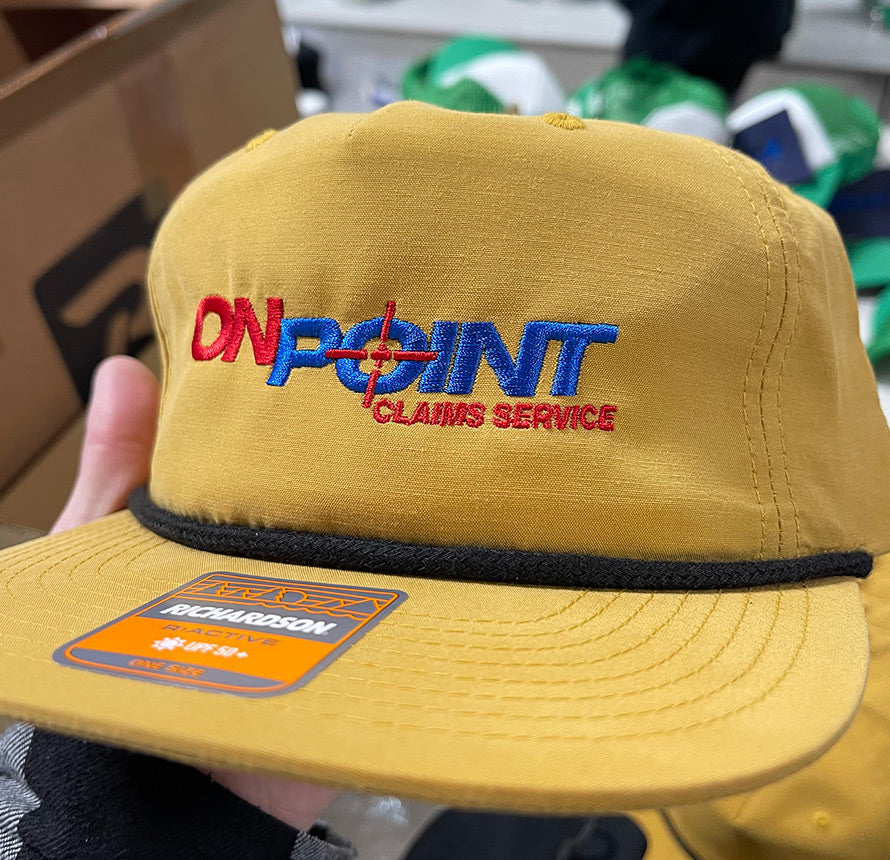 Yellow Richardson hat with 'On Point Claims Service' embroidered.