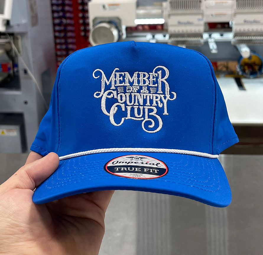 Blue hat with 'Member of a Country Club' embroidered on the front.