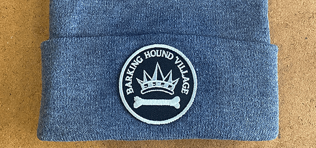 Gray Beanie with 'Barking Hound Village' patch featuring a crown and bone emblem in black and white.