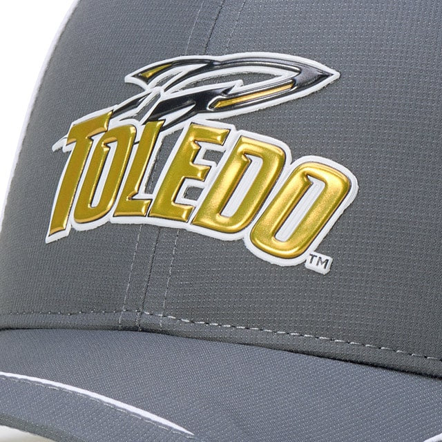 Close-up of a Toledo Rockets cap with a metallic logo and a swooping falcon design