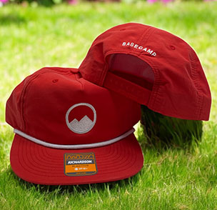 Red Basecamp cap with white logo on front and back