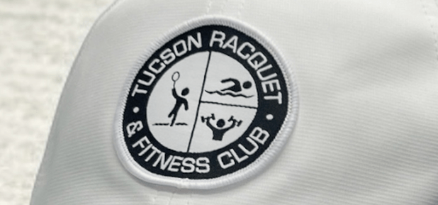 White Cap with 'Tucson Racquet & Fitness Club' patch showing icons for tennis, swimming, and fitness.